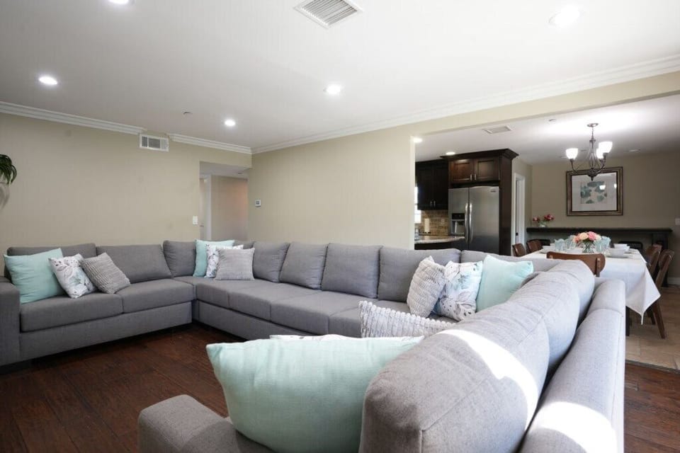 Living Room with Oversized sectional and Sleeper Sofa View 3
has Queen Pull-out looking into the Kitchen and Dining Room