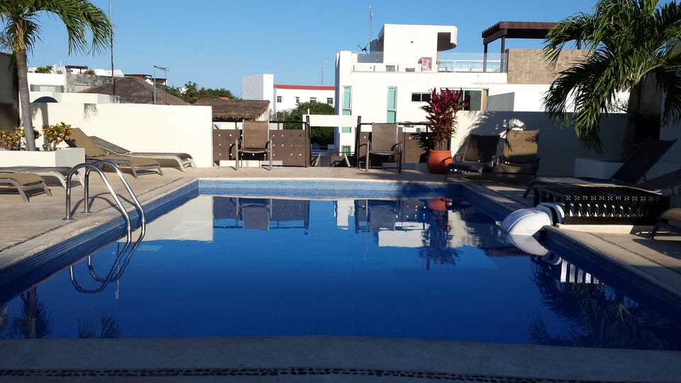 shared rooftop pool steps from condo