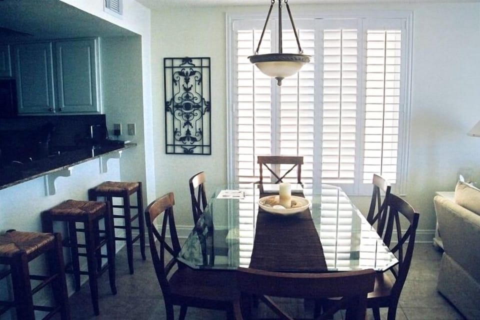 Dining room with 6 foot window and a beach view
