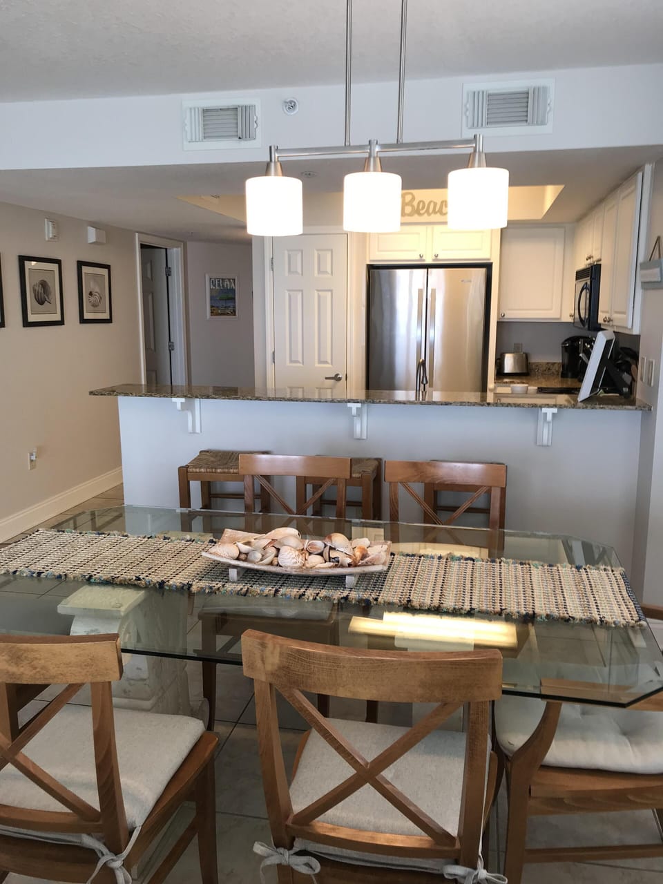 View of table, breakfast bar & kitchen 