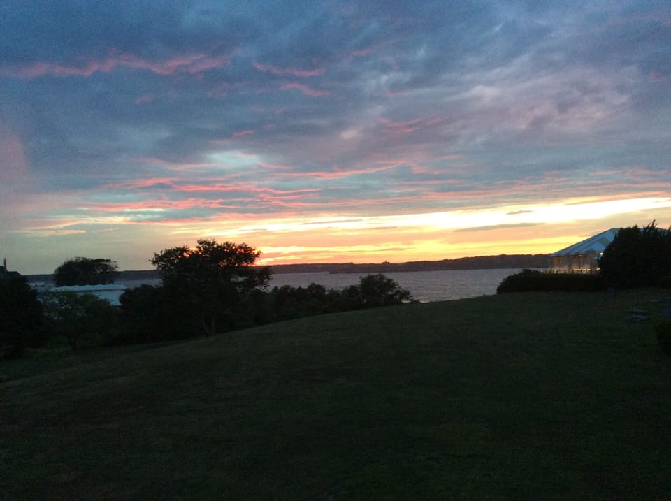 Sunset over the bay seen from the deck.