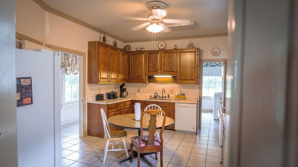 Kitchen - Between Dining and Living rooms. Connected to downstairs bedroom 3. 