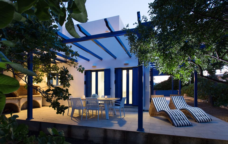 Terrace with loungers and dining table