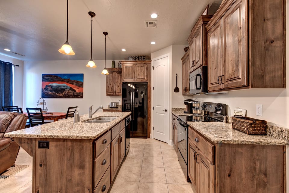 Side View of Kitchen - Side view of kitchen showing off the beautiful counter tops and stainless-steel appliances.