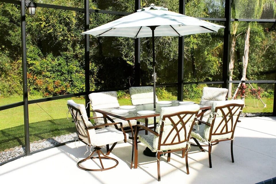 Relaxing poolside comfort, cradled in the quiet of a private wooded sanctuary.