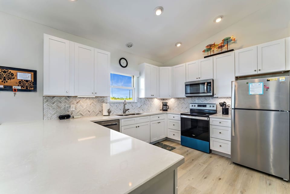 Kitchen is well equipped with loads of counterspace.