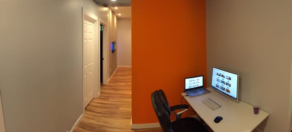 Computer Area with 27" monitor, wireless keyboard and mouse, and HDMI cable