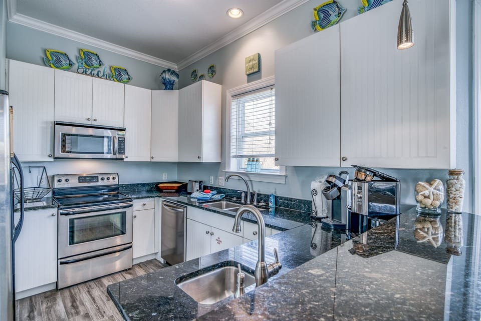 Kitchen with Granite Countertops, Stainless appliances. Kuerig Coffee