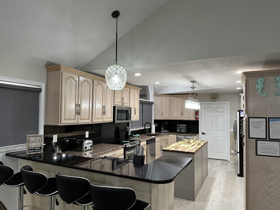 Bar seating for 8, High Chair, Well stocked kitchen made for entertaining