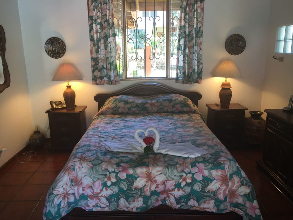 Master queen bed overlooks pool