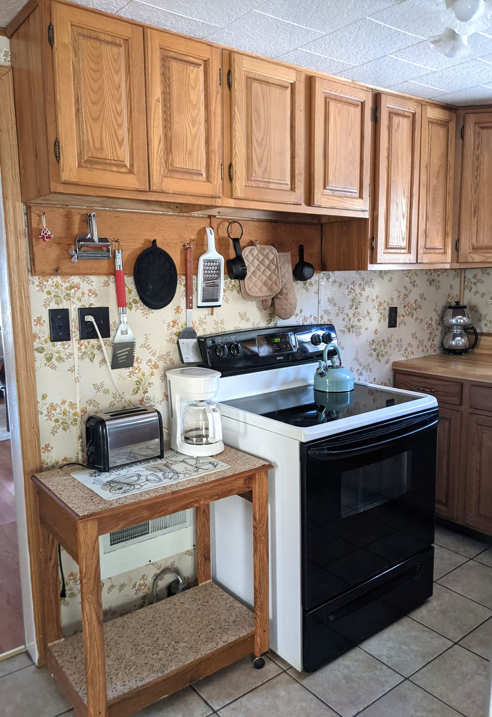 Kitchen with electric range.