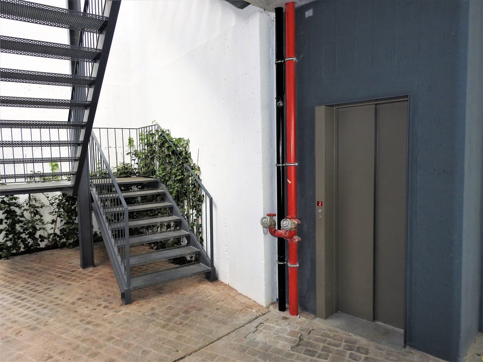 Main stairs and elevator up to all floors.