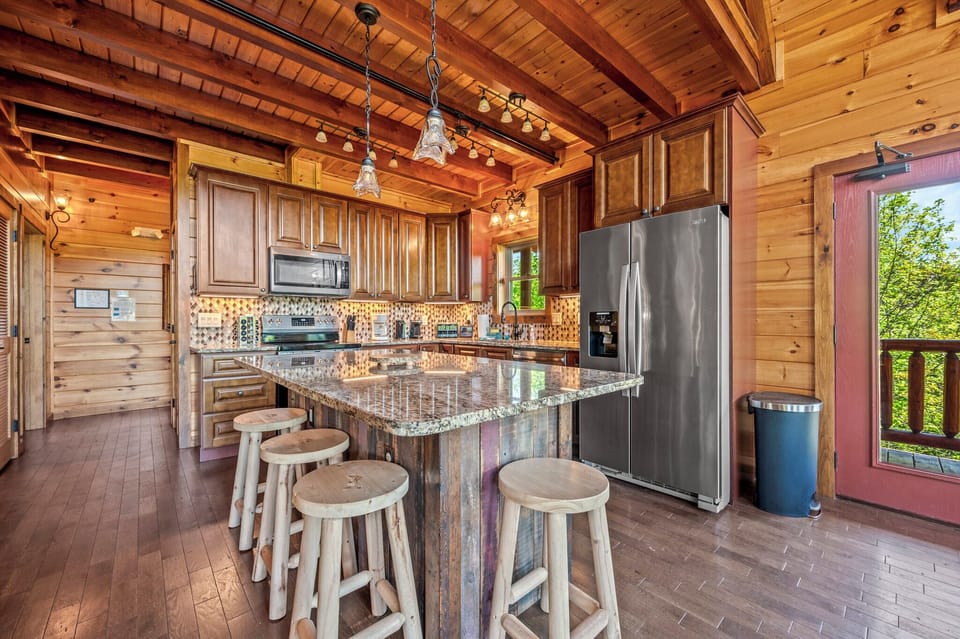 Up-to-date kitchen with soft-close cabinets, stainless appliances, and granite. Island seast 4