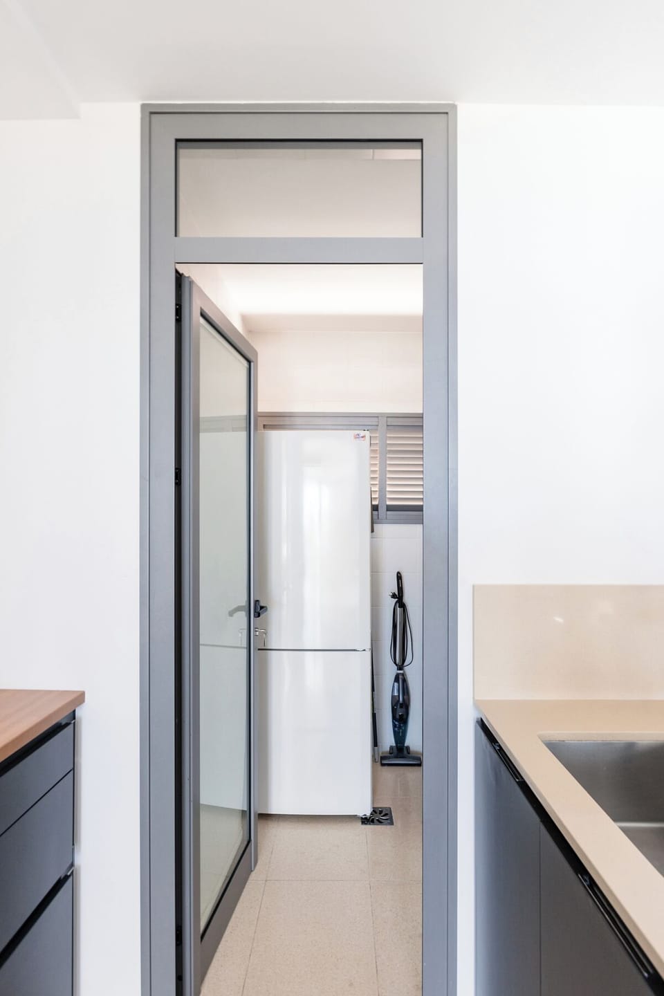 space adjacent to the kitchen for fridge and dishwasher