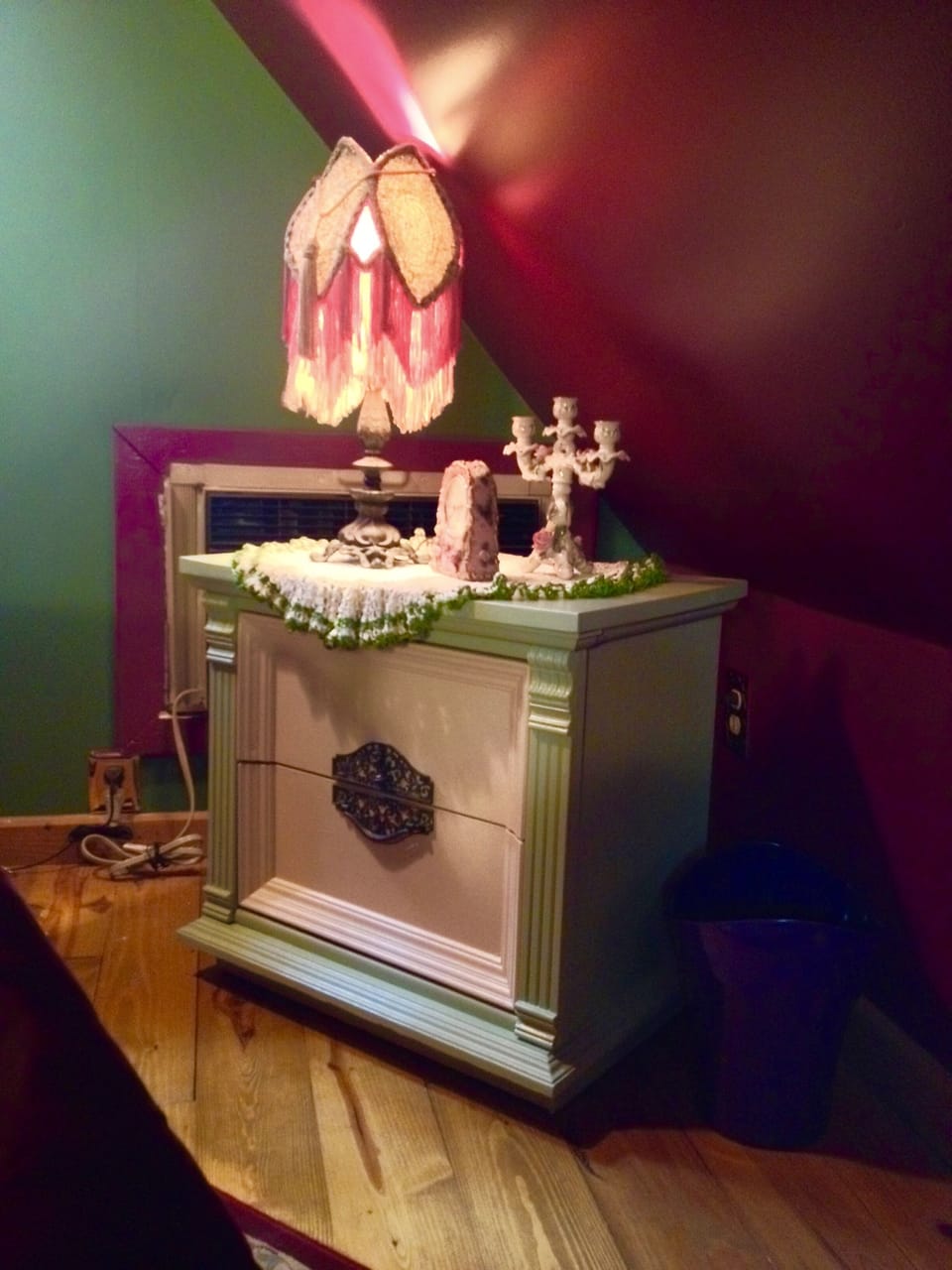 Another bedroom chest with antique lamp
