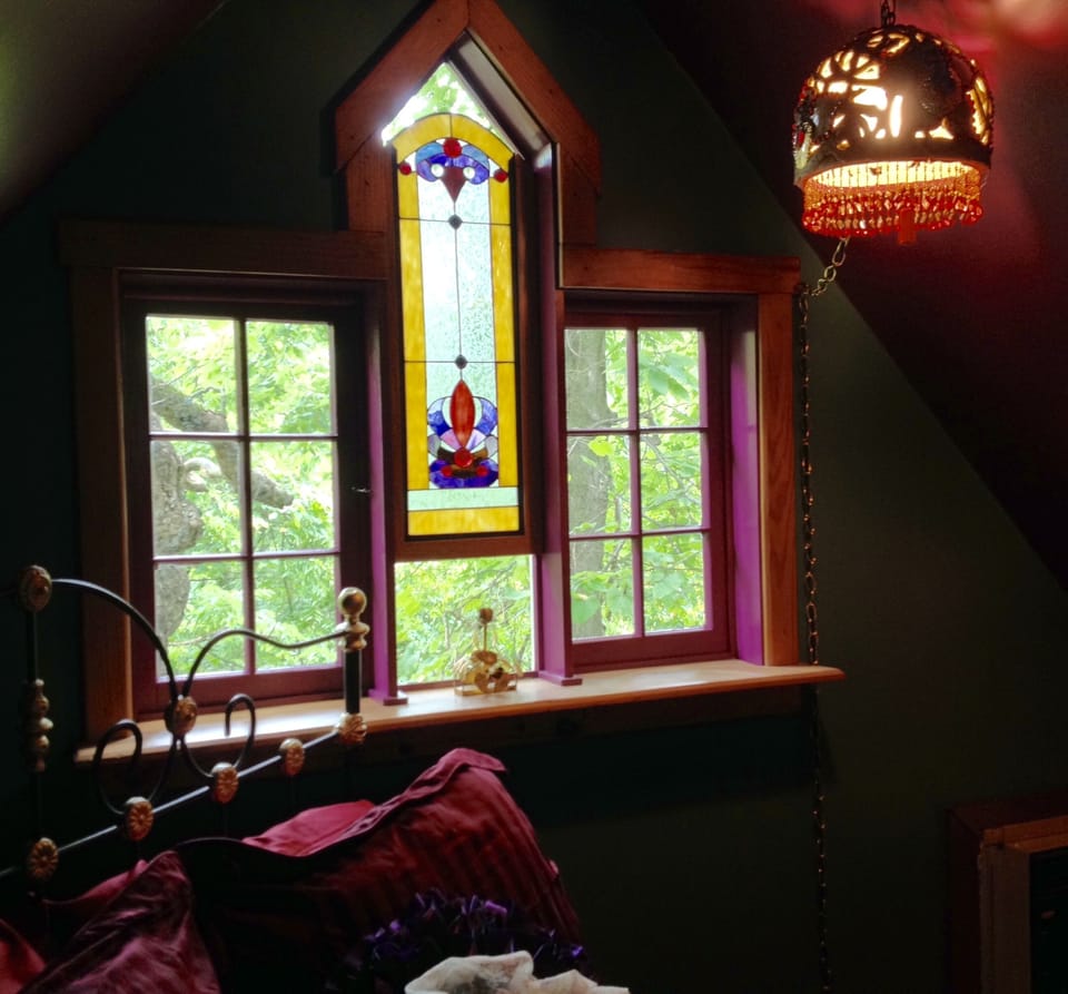 Stained glass window in loft bedroom