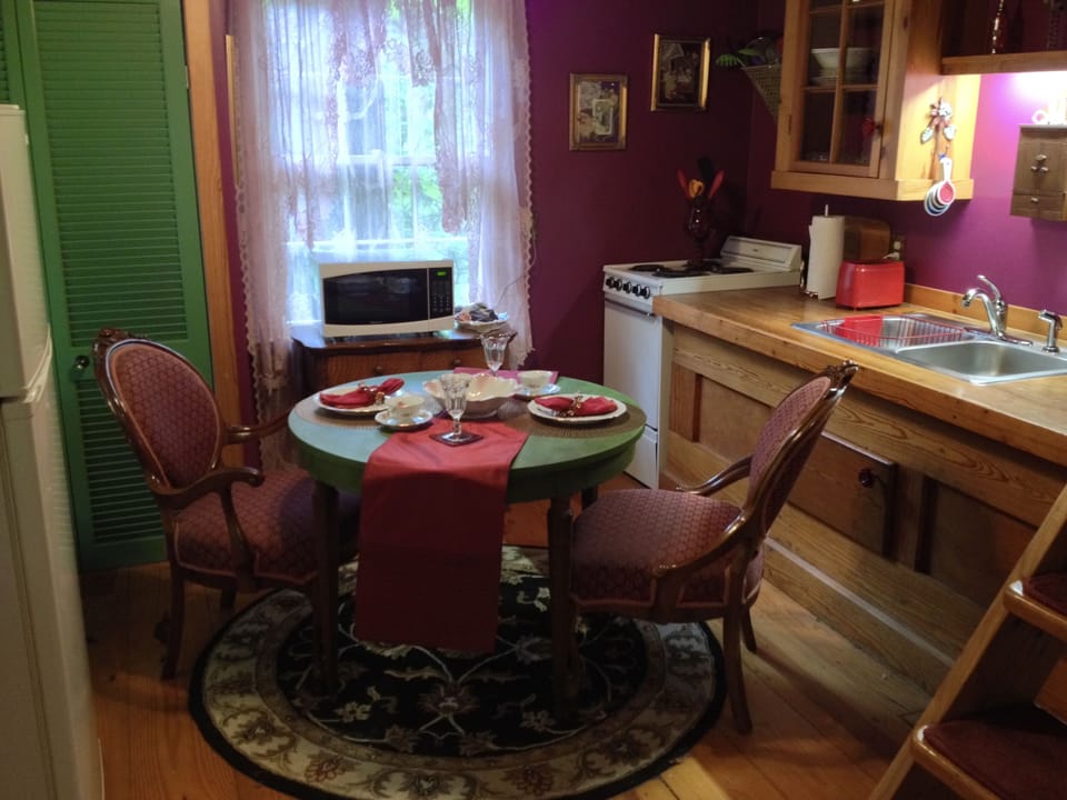 Kitchen and eating area, with antique chairs