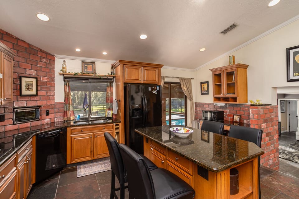 Gourmet kitchen with granite counter tops and large island