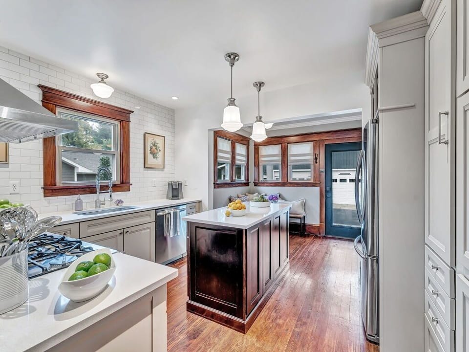 Looking from dining room into kitchen and breakfast nook