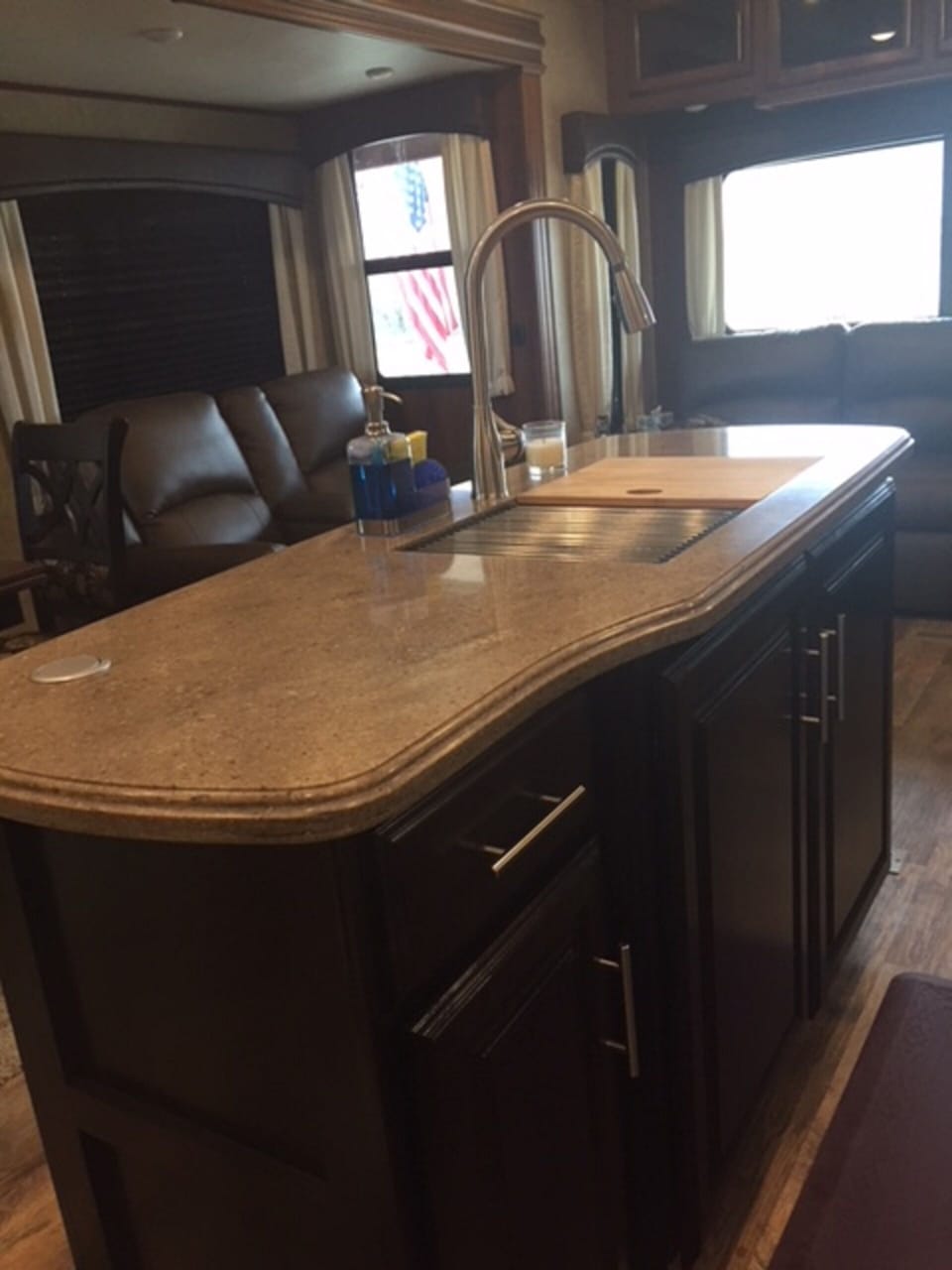 Double sink with lots of counter space and cabinets.