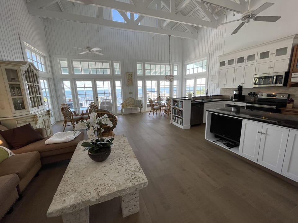 New Great Room with white interior and beautiful new tile floors.