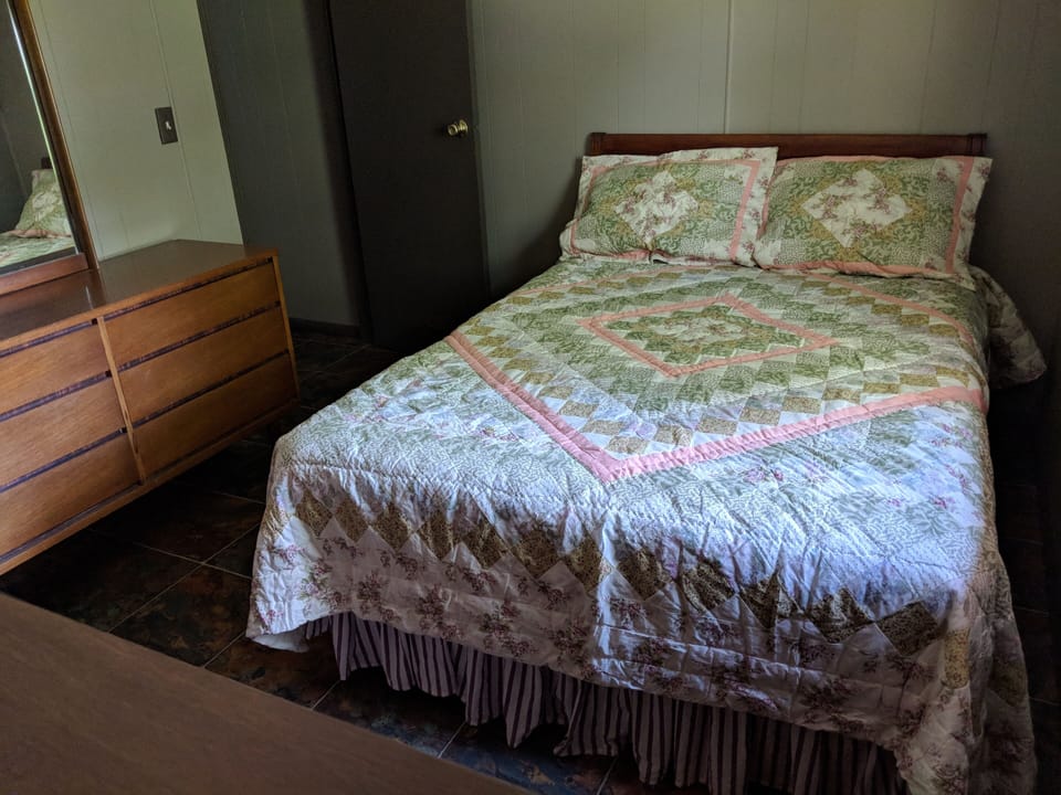 double bed in small bedroom.