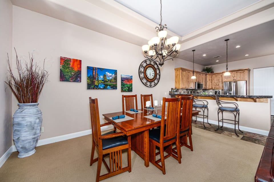 Large Dining Area With Bar Seating And Table With Chairs