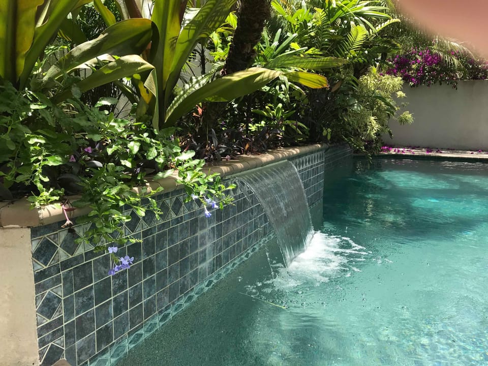 Tranquil fountain in beautiful and private saltwater pool.