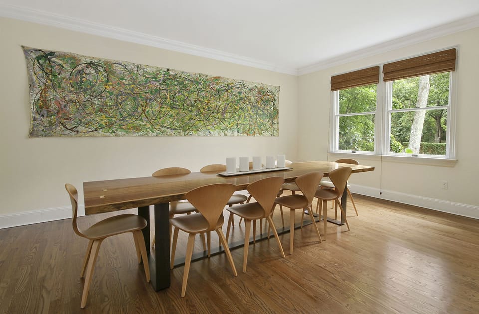 Formal Dining Room With Custom Made Natural Wood Table With Steel Base