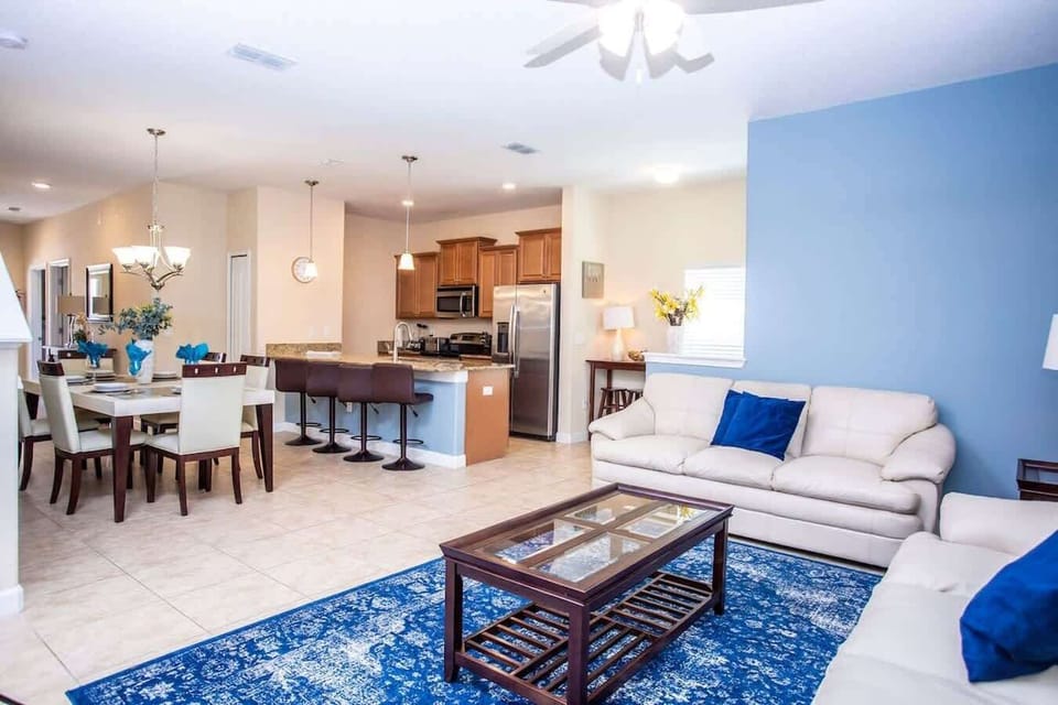 Living Room W View Of The Kitchen and Dining Room 