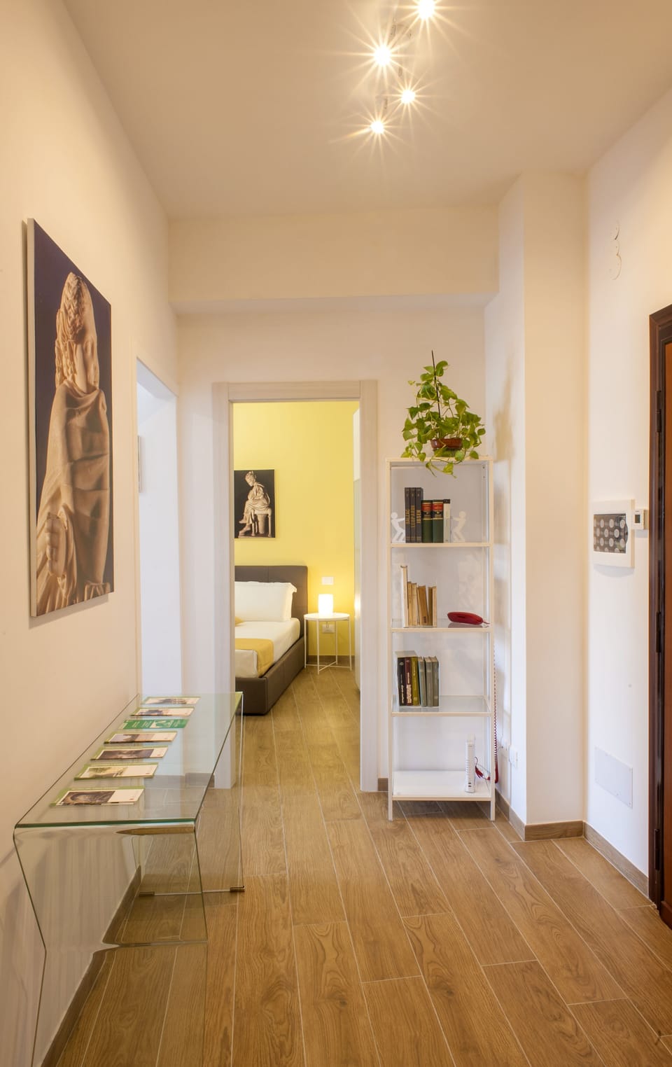 The entrance with a little library