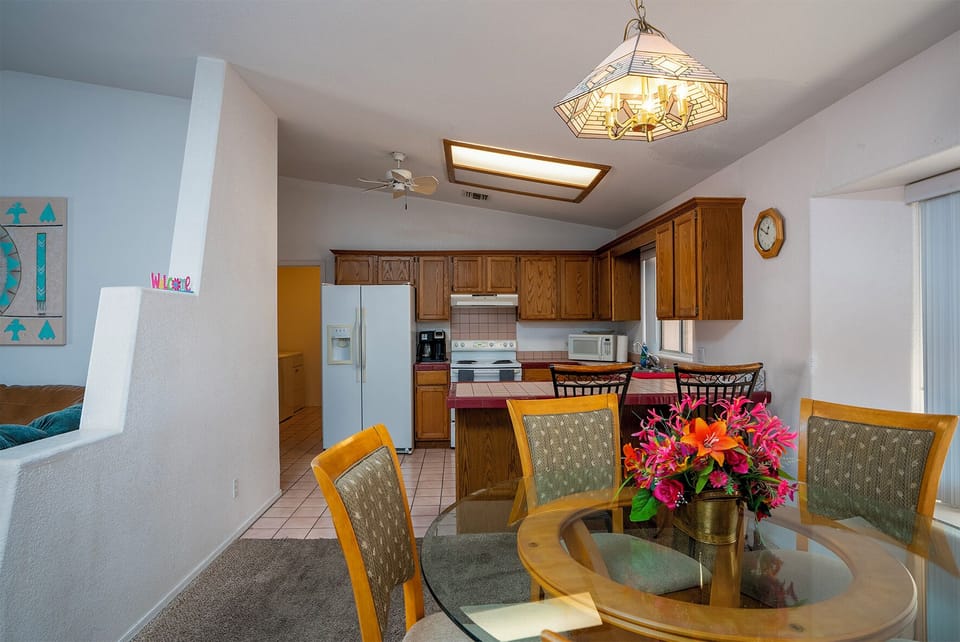 Formal   dining for 6 + 2  at bkfst bar plus living room/ coffee table/ outside.