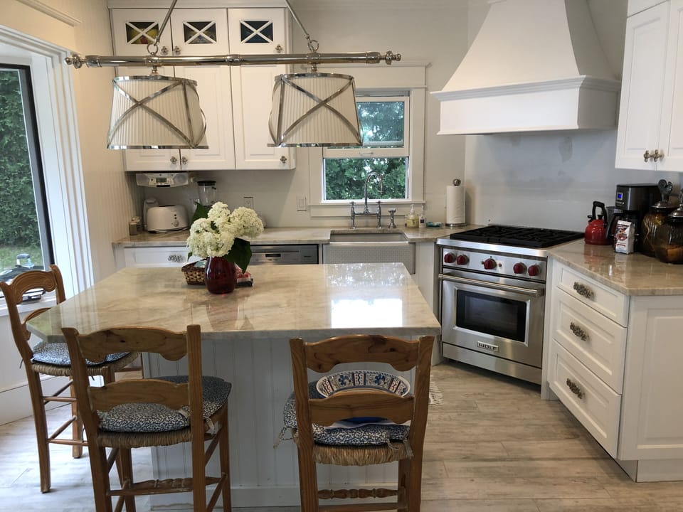 Kitchen with counter and 3 chairs 