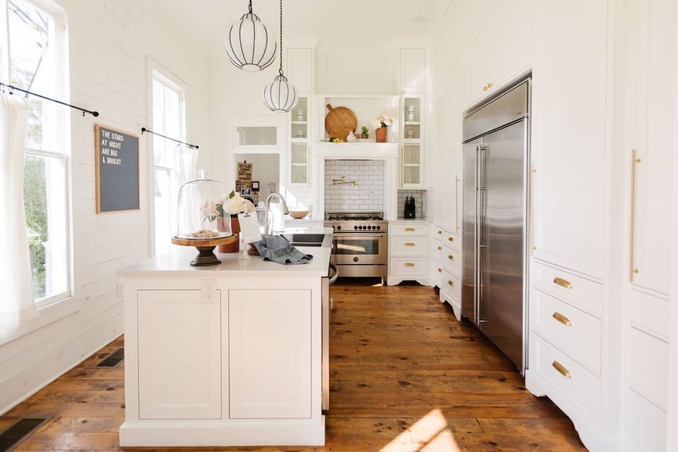 The kitchen is equipped with dishes, appliances and cookware for guests.