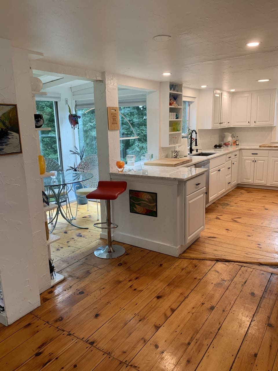 View of kitchen and dining area upon entering.