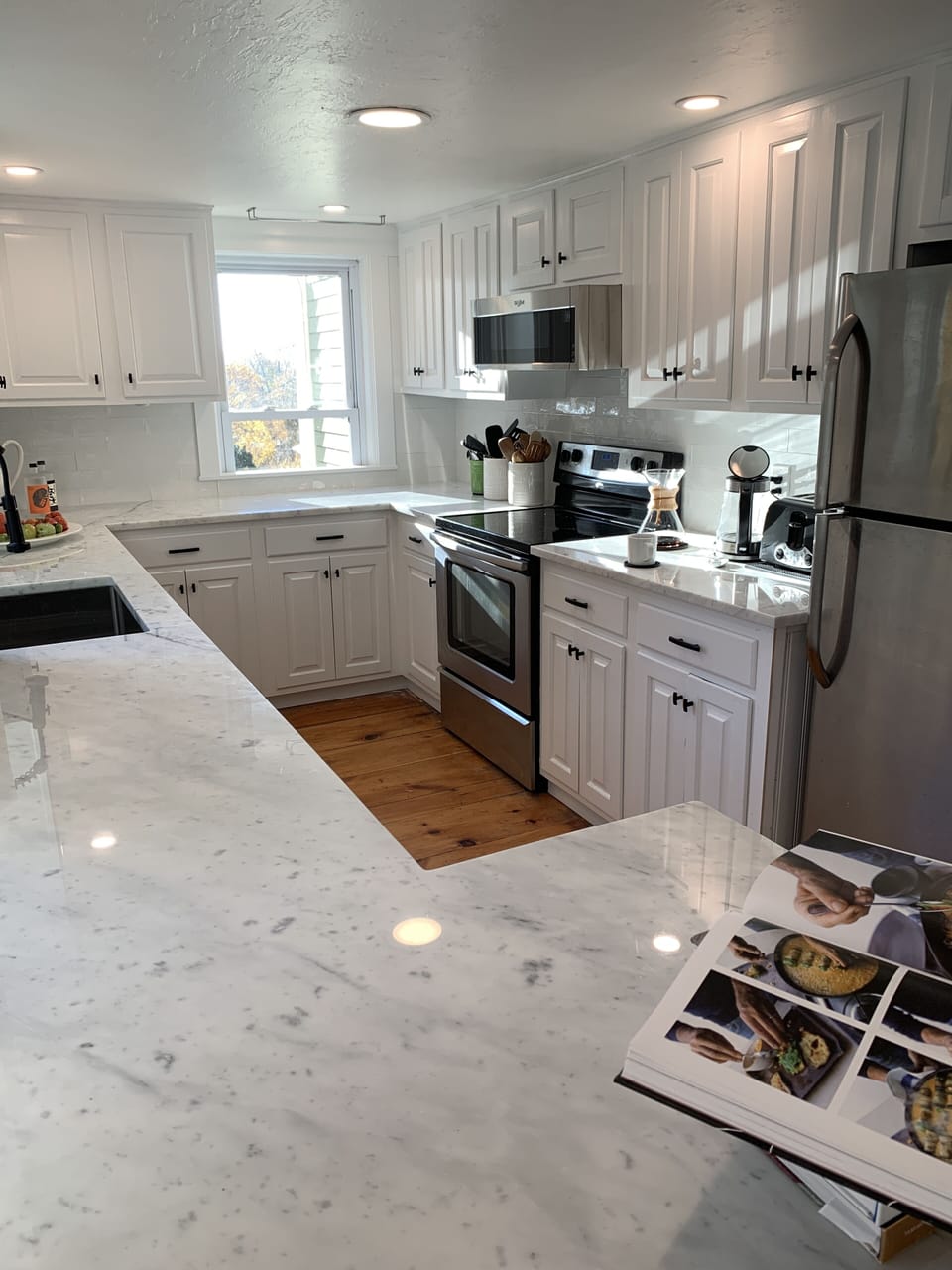 Long view of kitchen in sunlight.