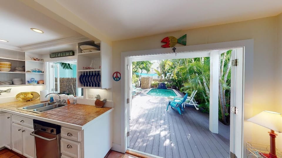 French doors to deck and pool.  Take a dip!