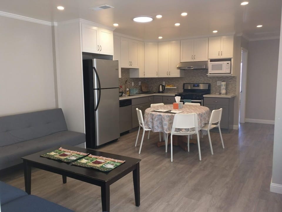 Spacious Living Room & Kitchen – Fully equipped for your convenience.