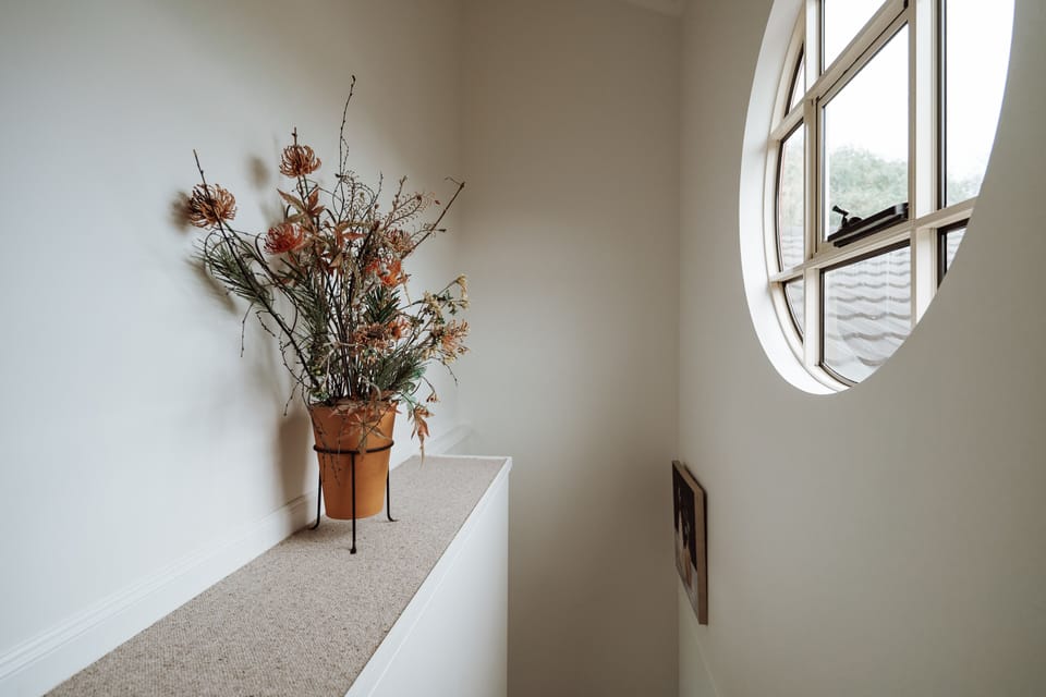 Escape upstairs to the master bedroom.