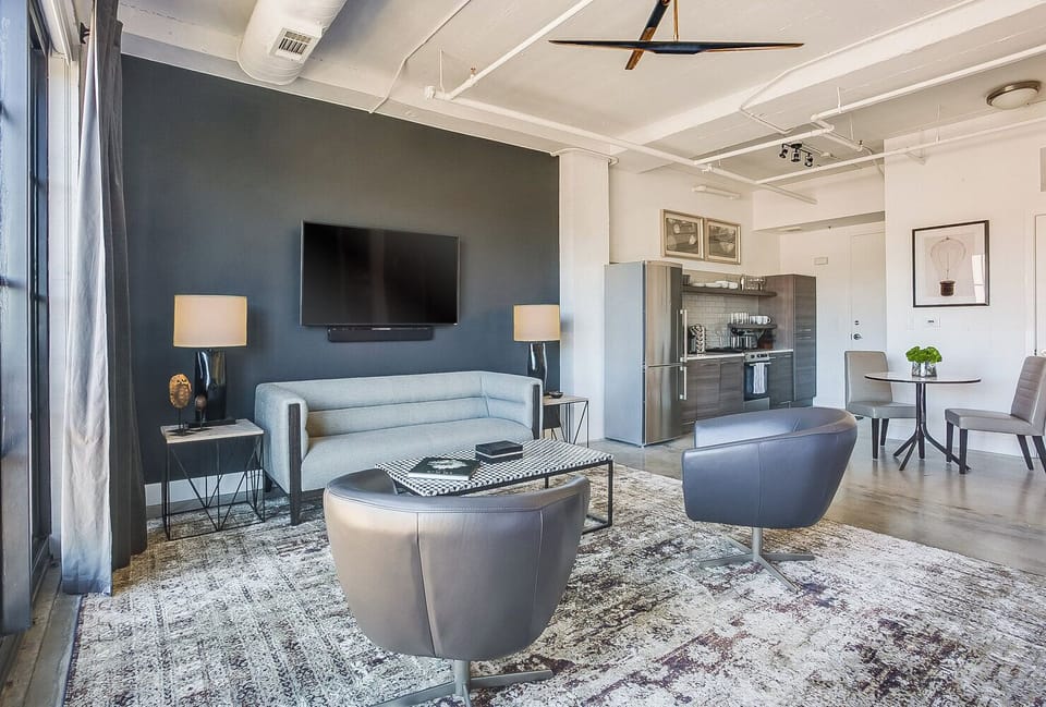 Living Area with Sofa, two Chairs, and Coffee Table