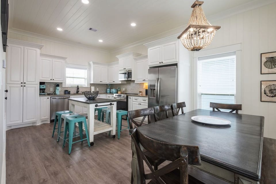 Large kitchen with island and dining table.