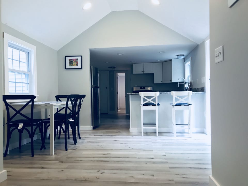 Open concept living room and dining room/kitchen. 