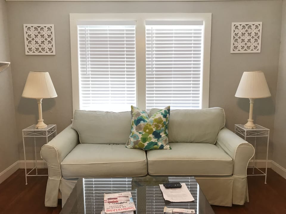 Comfortable sitting area that faces a 51" tv screen.