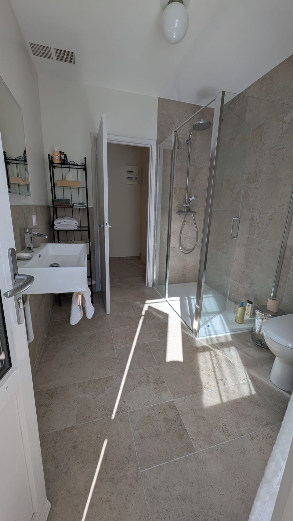 The shower doors opens in both directions for easy access. All towels are provid