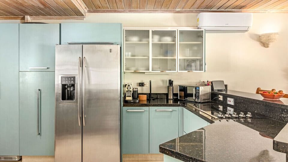 Superb kitchen, note Nespresso machine for caffeine fix ! 