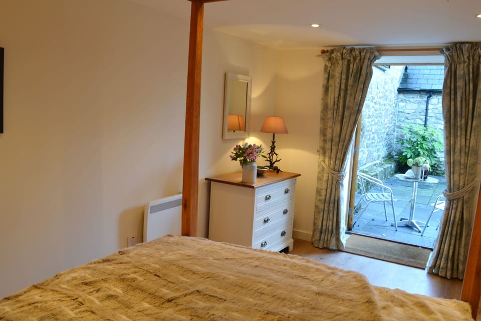 The bedroom opens out onto the courtyard - perfect for morning coffee