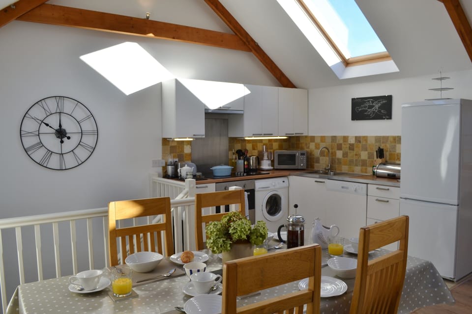 The dining area and kitchen -the cook won't miss out on any of the action!