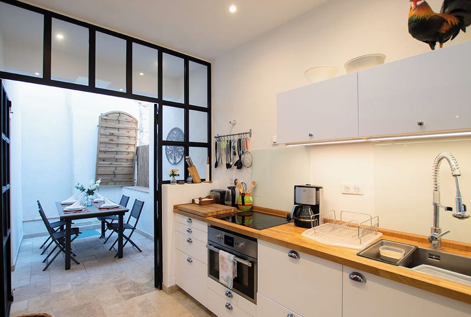 Kitchen leading onto open terrace outside
