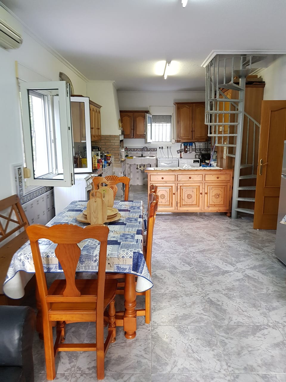 Spainish country style kitchen,with gas cooker , and facility to cook over a log