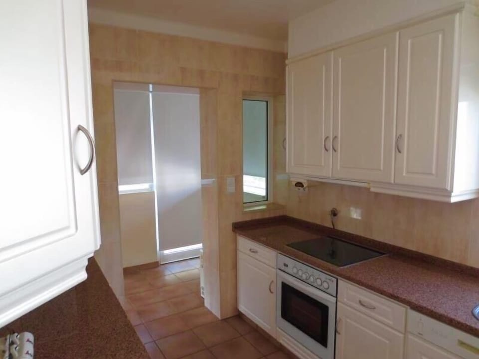 Arch leading to utility area & balcony